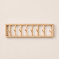 porte-manteau mural bois naturel 70 cm 7 patères – vue principale sur fond beige