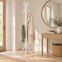 Porte-manteau sur pied blanc dans une entrée scandinave avec miroir rond
