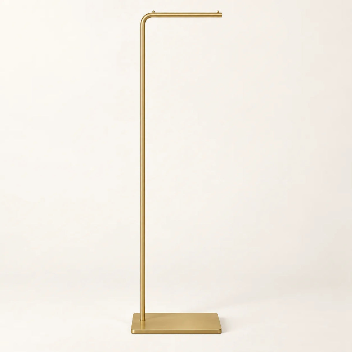 Porte-manteau valet design en métal doré brossé de 170 cm sur fond clair