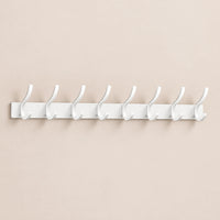 Crochet mural pliant blanc 8 crochets aluminium, porte-manteau mural blanc : vue complète sur mur beige