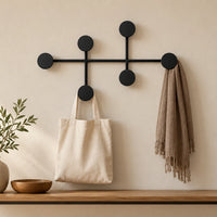 Mise en situation illustrative du modèle noir dans une entrée, accessoires non inclus