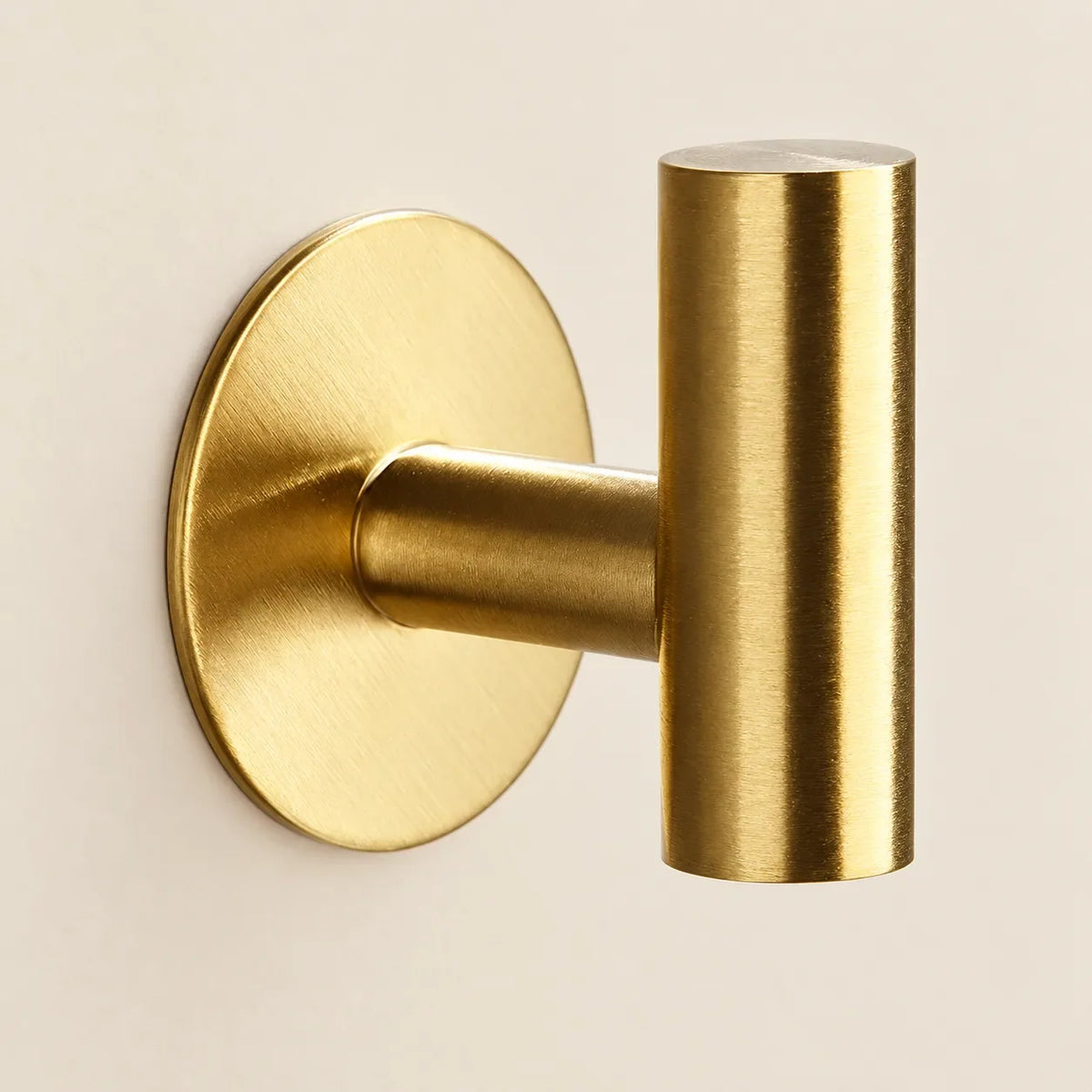 Patère design dorée en inox adhésive : détail de finition
