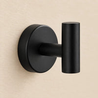 Patère design noire en inox à vis : détail de finition