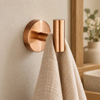 Patère design or rose en inox à vis : petite serviette suspendue