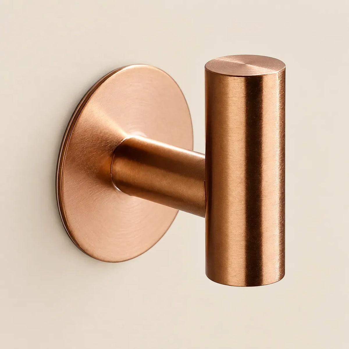 Patère design or rose en inox adhésive : détail de finition
