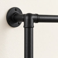 Penderie murale noire 102,5 cm à 2 barres : détail des tubes et de la fixation