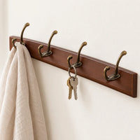 Porte-manteau mural en pin brun, 4 crochets, 38 cm : utilisation